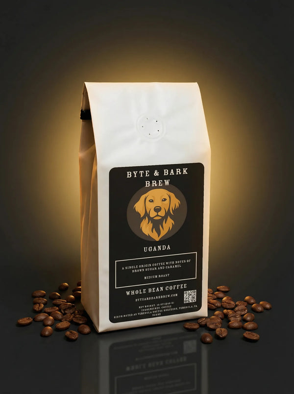 Coffee bag with 'Byte & Bark Brew' label and scattered coffee beans on a dark background