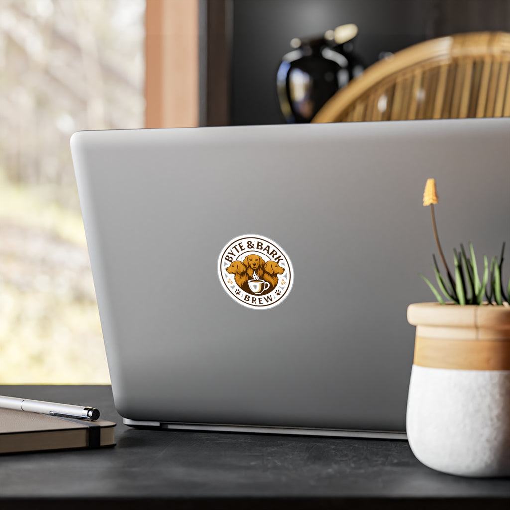 Laptop with a "Byte & Bark Brew" sticker on a desk with a blurred background