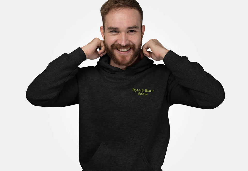 Man wearing a black hoodie with Byte & Bark Brew on the front