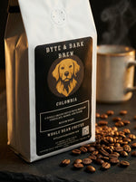 Coffee bag labeled 'Byte & Bark Brew' with coffee beans and a mug in the background