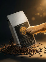 Dog paw reaching for a 'Byte & Bark Brew' coffee bag with coffee beans around.