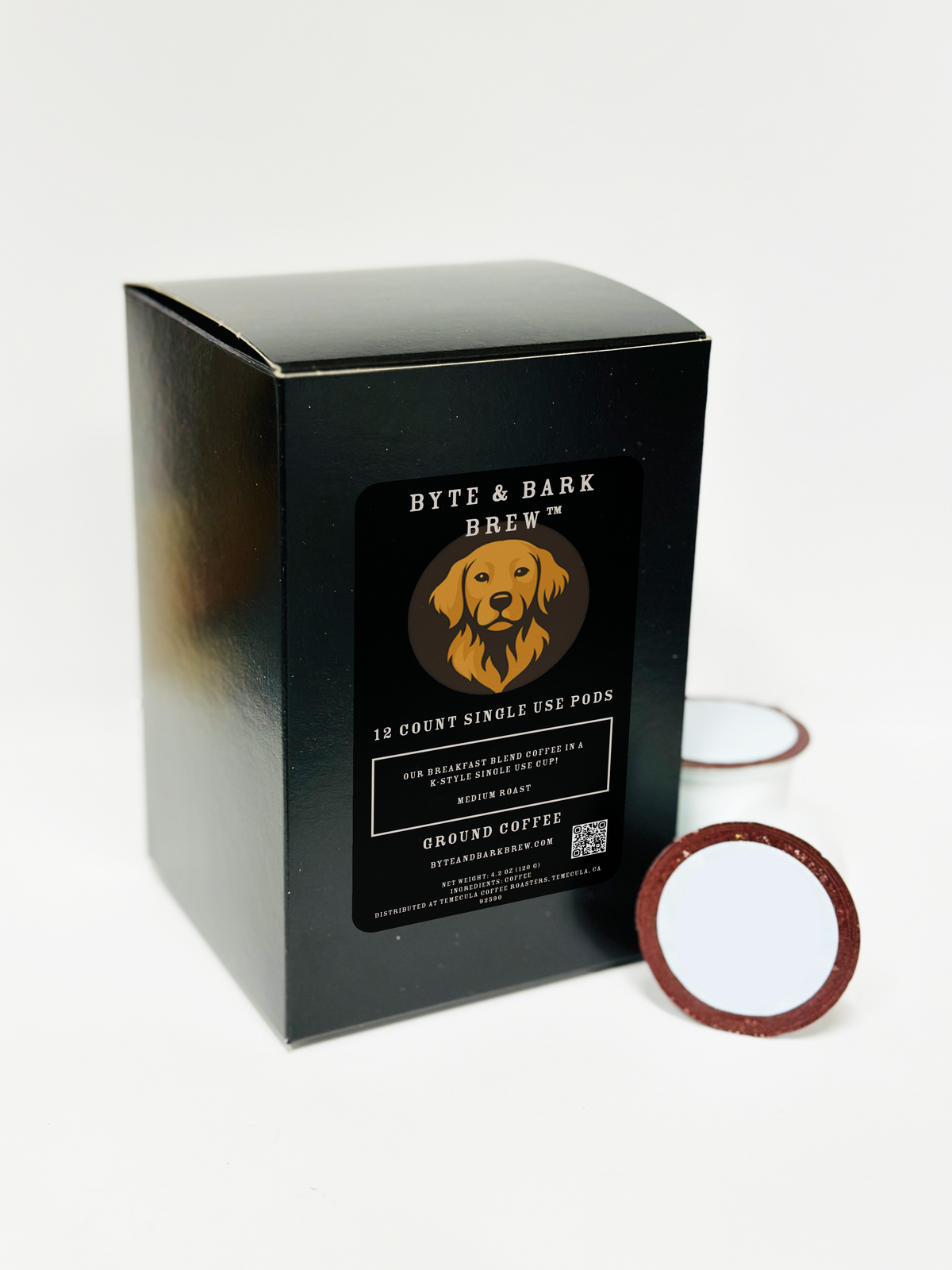 Black rectangular box labeled Byte & Bark Brew® with dog logo and two single-serve pods