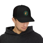 Man wearing a black cap with a logo on a white background