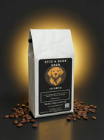 Coffee bag labeled 'Byte & Bark Brew' with coffee beans on a dark background