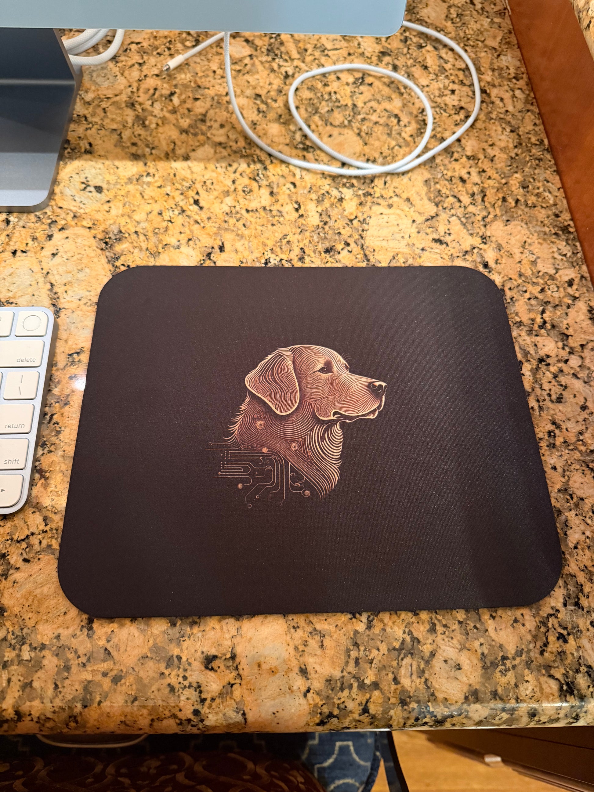 Mouse pad with a dog design on a desk
