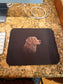 Mouse pad with a dog design on a desk