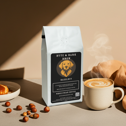 Byte & Bark Brew Hazelnut Whole Bean Coffee with spilled beans and pastries — a warm, inviting café moment captured at home.