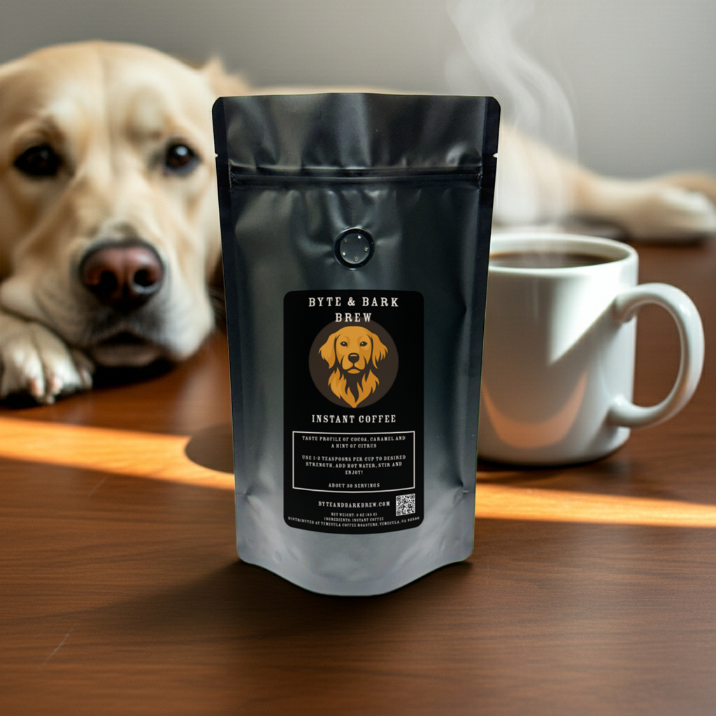 Bag of Byte & Bark Brew Instant Coffee on a desk beside a cup of coffee and a golden retriever — crafted for dog lovers with busy mornings.