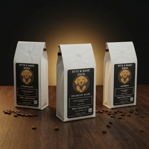 Three coffee bags from Byte & Bark Brew on a wooden surface with scattered coffee beans.